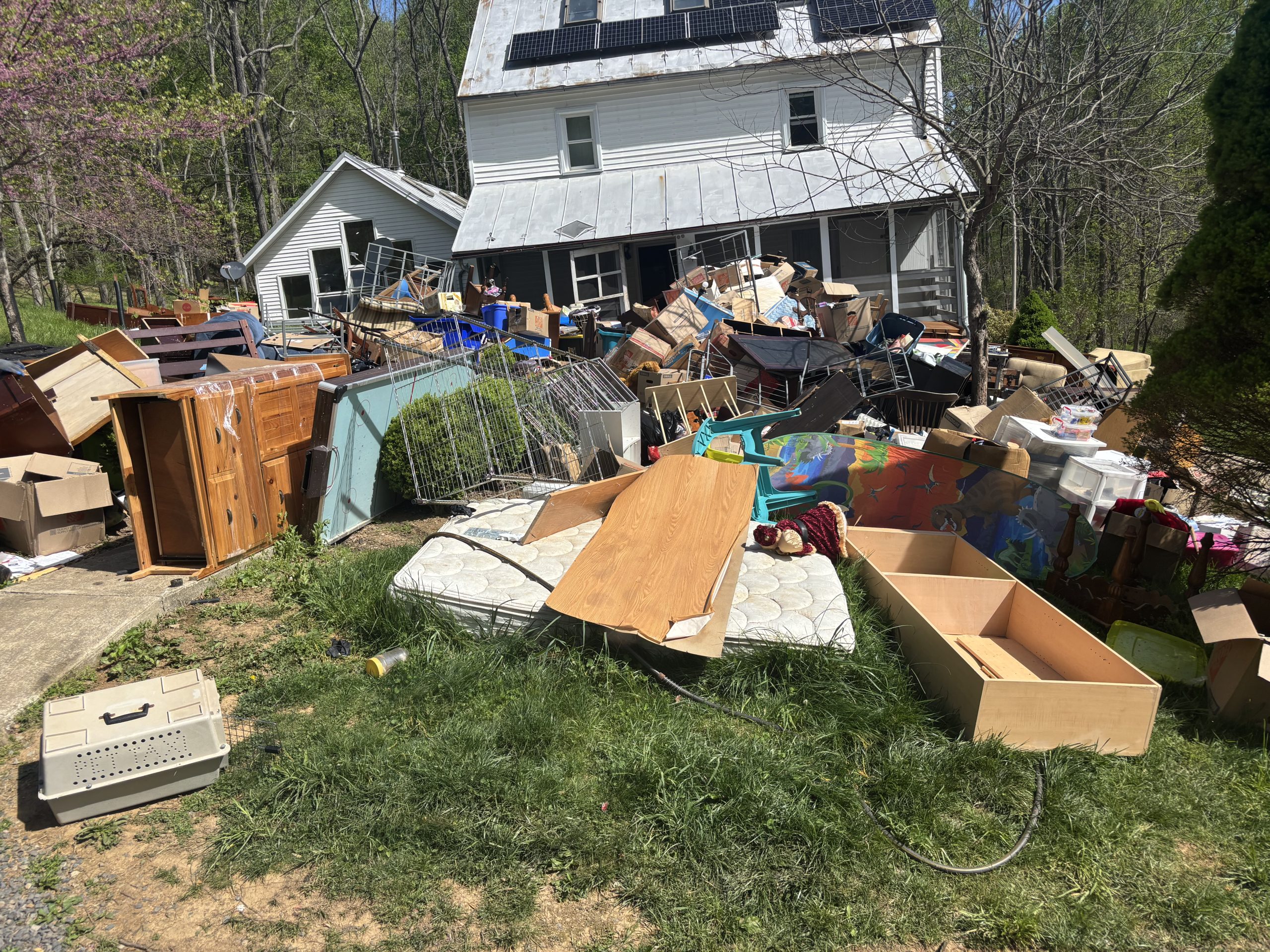 Large residential junk cleanout pile before hauling in Rockville, MD Large residential junk cleanout pile before hauling in Rockville, MD