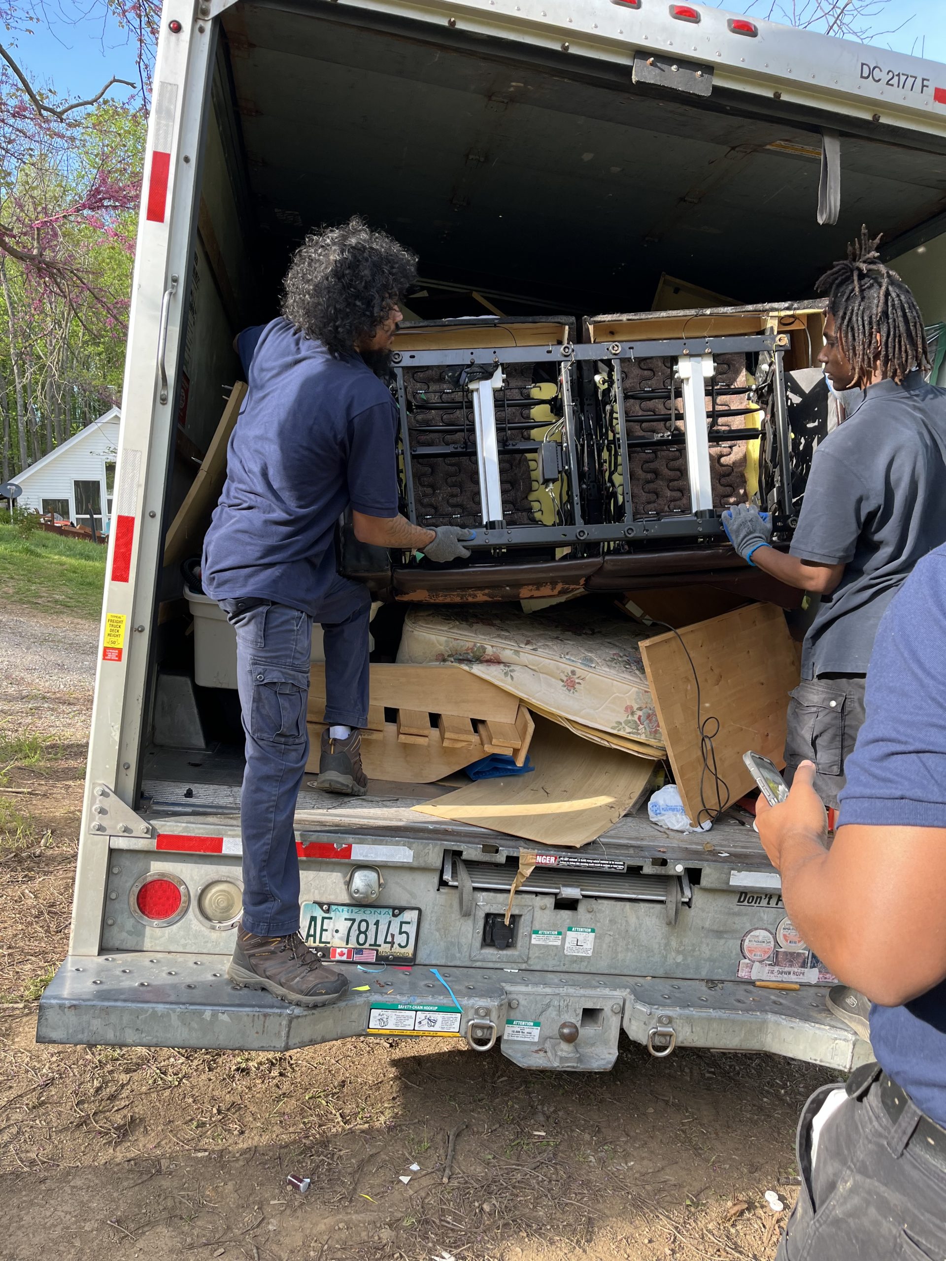 Team loading a sofa onto a junk removal truck in Rockville, MD Team loading a sofa onto a junk removal truck in Rockville, MD